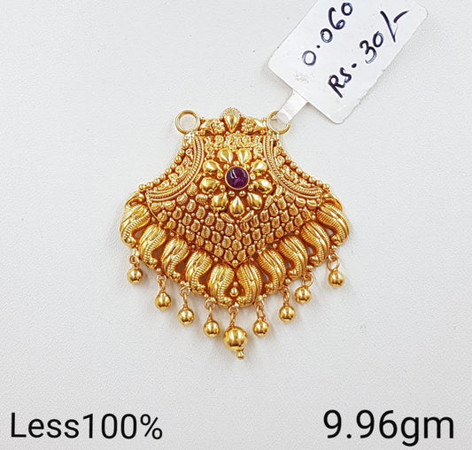 Grand Gold Pendant with Central Floral Motif and Red Stone